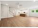 Open concept living room and kitchen with stairs and hardwood floors at 13134 Macon Hall Dr, Mint Hill, NC 28227