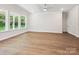 Spacious living room featuring lots of windows and wood-look flooring at 13134 Macon Hall Dr, Mint Hill, NC 28227