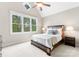 The cozy bedroom features a large window and vaulted ceiling at 132 Tuskarora Point Ln, Mooresville, NC 28117
