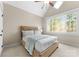 The bedroom offers a large window, vaulted ceiling, and carpeted floor at 132 Tuskarora Point Ln, Mooresville, NC 28117