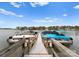 Community boat dock with a variety of boats available on a bright, sunny day at 132 Tuskarora Point Ln, Mooresville, NC 28117