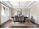 Formal dining room featuring an ornate chandelier and area rug for refined elegance at 132 Tuskarora Point Ln, Mooresville, NC 28117