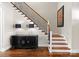 An elegant staircase features hardwood treads and a black iron railing at 132 Tuskarora Point Ln, Mooresville, NC 28117