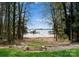 A waterfront lot with a private beach, mature trees, and views of the lake at 132 Tuskarora Point Ln, Mooresville, NC 28117