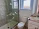 Tiled bathroom with glass-enclosed shower and bright vanity at 13308 Chopin Ridge Rd, Huntersville, NC 28078