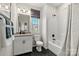 Clean bathroom featuring black hexagon floor tiles, shower and granite vanity at 13308 Chopin Ridge Rd, Huntersville, NC 28078