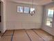 Bright dining room with wainscoting, contemporary light fixture and large windows at 13308 Chopin Ridge Rd, Huntersville, NC 28078