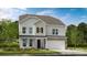 Charming two-story home with stone accents, a two-car garage, and a well-maintained front lawn at 13308 Chopin Ridge Rd, Huntersville, NC 28078