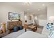 Open-concept living room showcasing wood floors, a TV, and cozy decor, perfect for modern living at 13308 Chopin Ridge Rd, Huntersville, NC 28078
