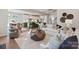 Beautiful living room showcasing open floor plan with a view of the modern kitchen at 13308 Chopin Ridge Rd, Huntersville, NC 28078