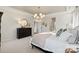 Elegant main bedroom featuring a chandelier, dresser and bright white walls at 13308 Chopin Ridge Rd, Huntersville, NC 28078