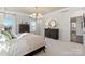 Comfortable main bedroom with a decorative ceiling, dark wood furniture, and neutral decor at 13308 Chopin Ridge Rd, Huntersville, NC 28078