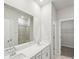 Contemporary bathroom featuring double sinks, sleek hardware, and a glass-enclosed shower at 1418 Windy Park Dr, Stanley, NC 28164