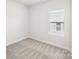 Neutral bedroom with a window and carpet, providing a cozy and blank canvas to decorate at 1418 Windy Park Dr, Stanley, NC 28164