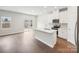 Bright open kitchen with a center island, modern appliances, and easy access to the outdoor patio at 1418 Windy Park Dr, Stanley, NC 28164