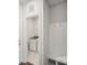 Functional laundry room with washer, dryer, storage, and a convenient bench for added utility at 1418 Windy Park Dr, Stanley, NC 28164