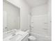 A bright and clean bathroom featuring a vanity and a shower-tub combo at 1422 Windy Park Dr, Stanley, NC 28164