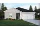 Charming single-story home featuring a two-car garage, manicured lawn and beautiful landscaping at 1422 Windy Park Dr, Stanley, NC 28164