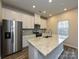 Modern kitchen featuring stainless steel appliances, ample storage, and granite countertops at 1424 Windy Park Dr, Stanley, NC 28164