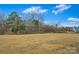Expansive backyard under a blue sky, providing ample space at 14629 Glen Valley Ct, Charlotte, NC 28278