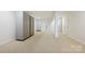 Spacious finished basement with storage cabinets and neutral carpeting at 14629 Glen Valley Ct, Charlotte, NC 28278