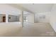 Large finished basement with bright white walls, and access to the outside at 14629 Glen Valley Ct, Charlotte, NC 28278