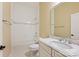 Bright bathroom featuring a marble countertop, and a tub with a tiled surround at 14629 Glen Valley Ct, Charlotte, NC 28278