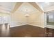 Dining room featuring hardwood floors, decorative molding, and a modern chandelier creates a perfect space for gathering at 14629 Glen Valley Ct, Charlotte, NC 28278