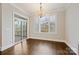 Dining area featuring hardwood floors, and a sliding door leading to an outdoor space, perfect for entertaining at 14629 Glen Valley Ct, Charlotte, NC 28278
