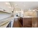 The kitchen features an oversized center island, updated stainless appliances, and an open layout to the living area at 14629 Glen Valley Ct, Charlotte, NC 28278