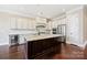 The kitchen features a large island with seating, modern appliances, and ample cabinet space for storage at 14629 Glen Valley Ct, Charlotte, NC 28278