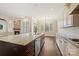A bright kitchen features a large island with a sink, stainless steel appliances, and an open layout to the eating area at 14629 Glen Valley Ct, Charlotte, NC 28278