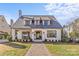 Charming white-brick home featuring a manicured front yard and a welcoming brick pathway at 1816 Beverly Dr, Charlotte, NC 28207