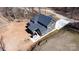 Scenic aerial view of modern house featuring neat landscaping, a driveway, and a backyard entertaining space at 2302 Rayecliff Ln, Charlotte, NC 28214