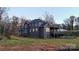 Stylish home exterior featuring a backyard patio perfect for outdoor living and entertaining at 2302 Rayecliff Ln, Charlotte, NC 28214