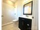 Bathroom with modern vanity, stylish tiled shower and neutral color scheme at 2302 Rayecliff Ln, Charlotte, NC 28214