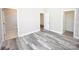 Neutral bedroom with a view of bathroom and gray vinyl plank flooring at 2302 Rayecliff Ln, Charlotte, NC 28214