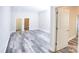 Neutral bedroom with a view of two doorways and gray vinyl plank flooring at 2302 Rayecliff Ln, Charlotte, NC 28214