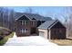 Inviting exterior showcasing brick and siding facade, two-car garage, and manicured front yard at 2302 Rayecliff Ln, Charlotte, NC 28214