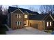 Attractive two-story home featuring brick and dark siding, a spacious driveway and garage at 2302 Rayecliff Ln, Charlotte, NC 28214