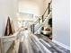 Foyer showcasing staircase, console table, hardwood floors, and an open floor plan at 2302 Rayecliff Ln, Charlotte, NC 28214
