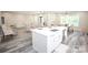 Bright, open-concept kitchen island with stainless steel dishwasher and sink at 2302 Rayecliff Ln, Charlotte, NC 28214