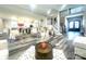 Bright living room showcasing open floor plan, modern décor, and hardwood floors at 2302 Rayecliff Ln, Charlotte, NC 28214
