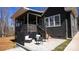 Relaxing outdoor patio area with modern furniture and manicured lawn at 2302 Rayecliff Ln, Charlotte, NC 28214