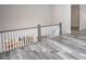 Second story balcony with view of main floor and gray vinyl plank flooring at 2302 Rayecliff Ln, Charlotte, NC 28214