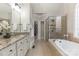 Luxurious bathroom with a soaking tub, glass shower, and double vanity at 258 Ridge Reserve Dr, Lake Wylie, SC 29710