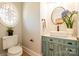 Charming half-bathroom features a custom vanity, decorative mirror and a unique round window at 258 Ridge Reserve Dr, Lake Wylie, SC 29710