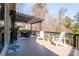 Spacious wooden deck featuring outdoor seating, a pergola, and wooded views at 258 Ridge Reserve Dr, Lake Wylie, SC 29710