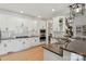 Gourmet kitchen with granite countertops, stainless steel appliances, and a view of the adjacent breakfast nook at 258 Ridge Reserve Dr, Lake Wylie, SC 29710