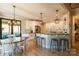 Bright and airy kitchen with white cabinets, stainless steel appliances, and an island with bar seating at 258 Ridge Reserve Dr, Lake Wylie, SC 29710